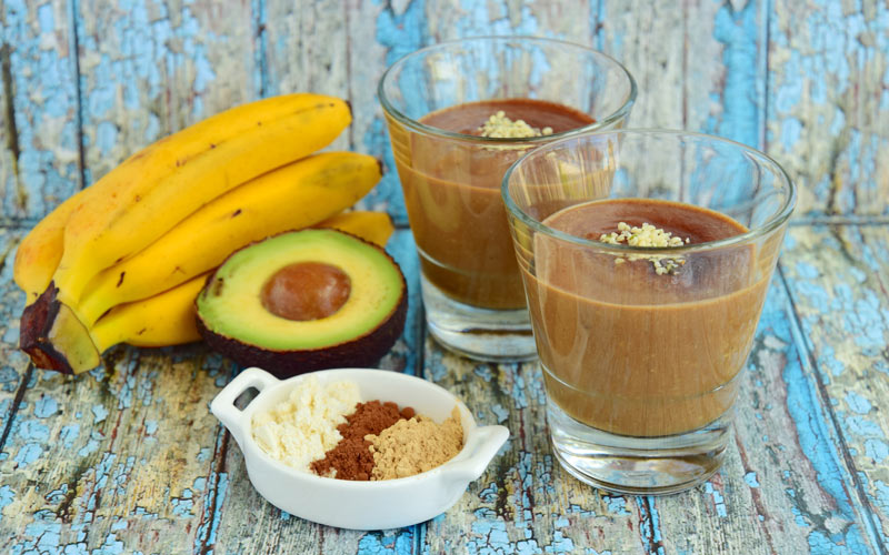Two Servings of Magnesium Boosting Smoothing in Glasses with Banana and Avocado - Happy Healthy You